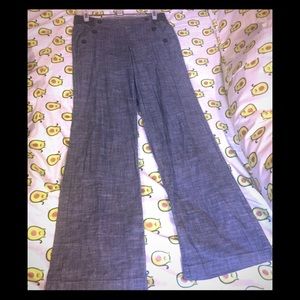 Cute gray pants with buttons along pockets